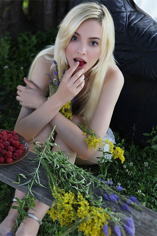  she devours a succulent raspberry between her luscious lips