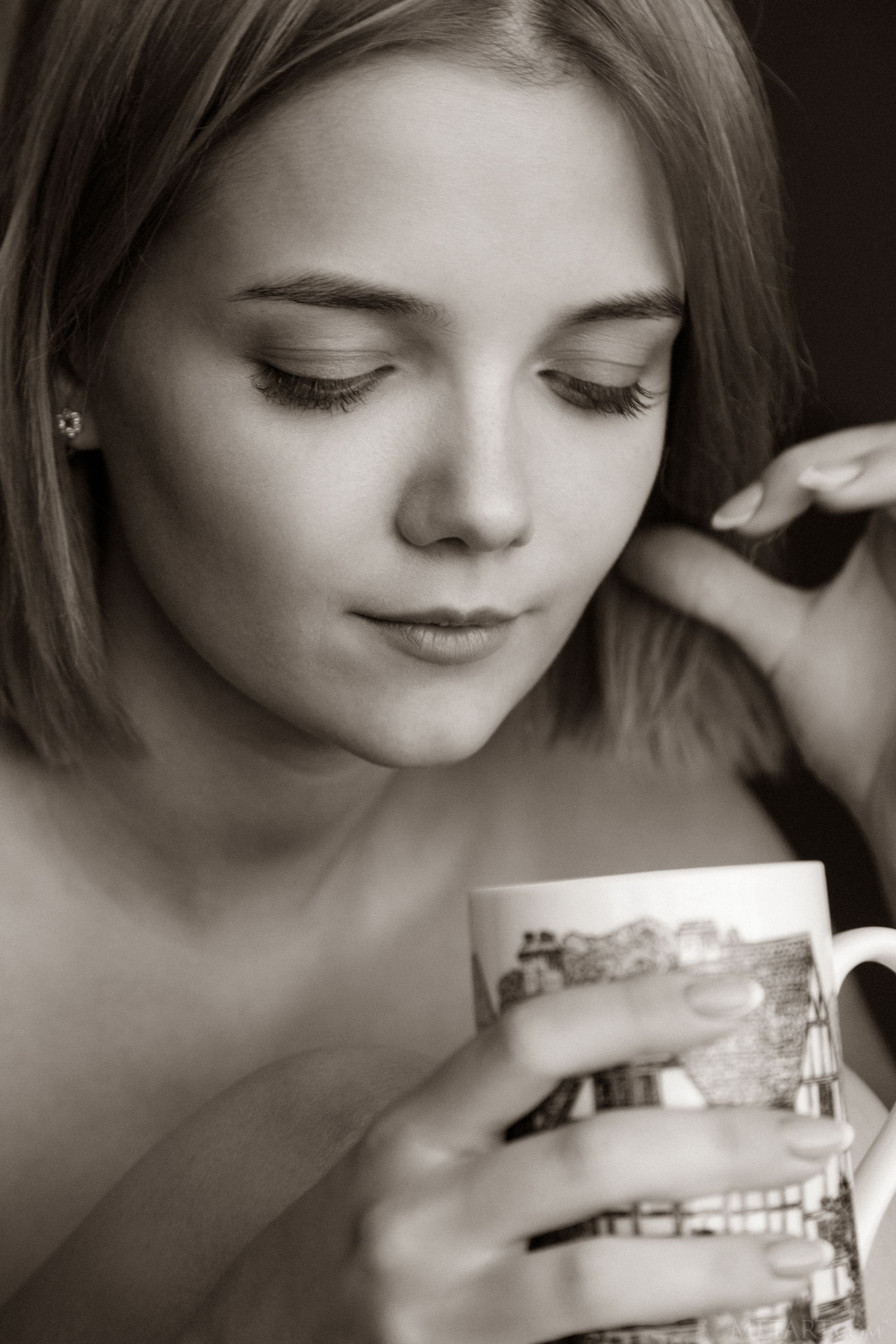 Stunning blonde Chanel Fenn sips her tea on the balcony 19