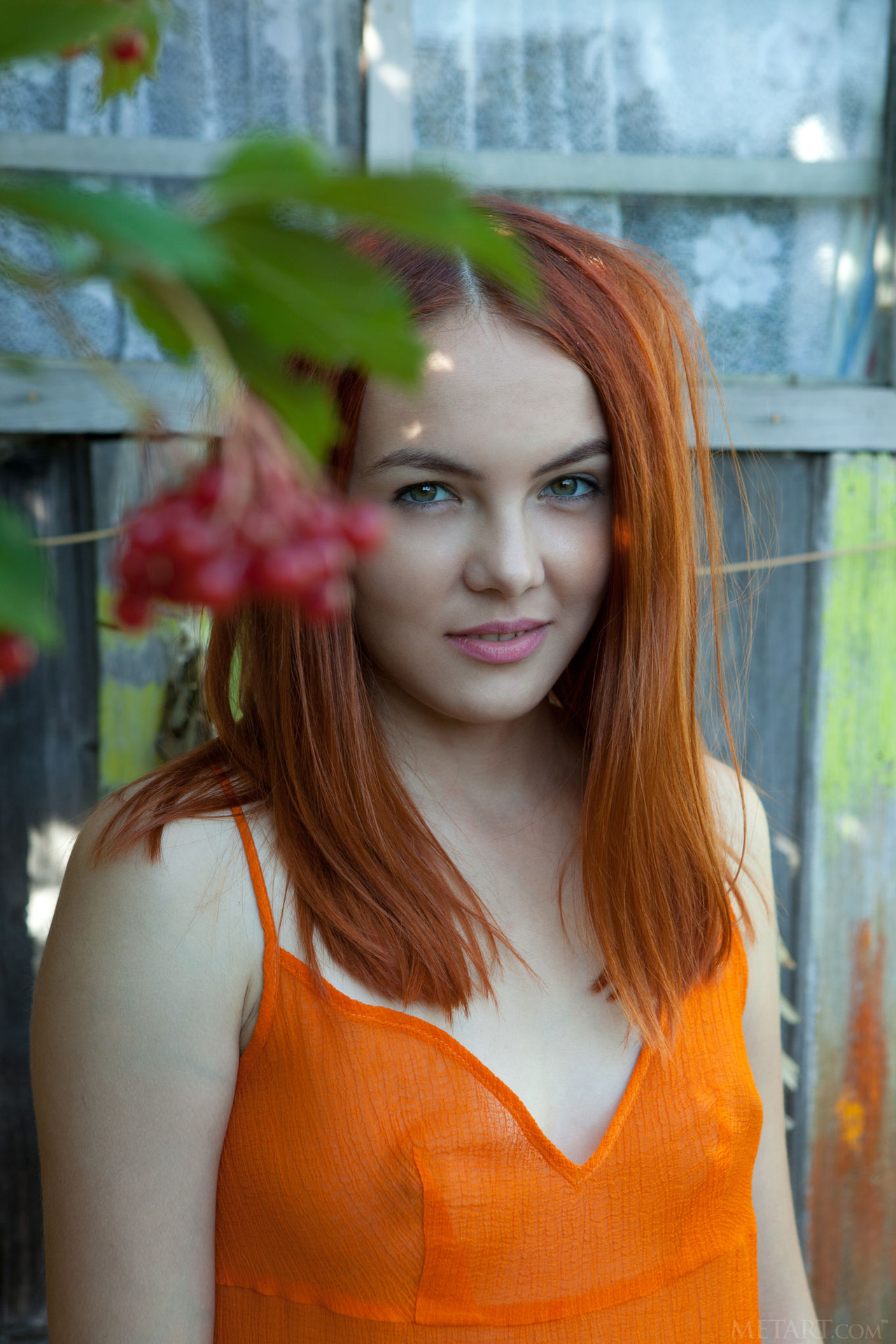 Sexy redhead Shaya lets her bright orange dress slip down to bare her gorgeous breasts 00