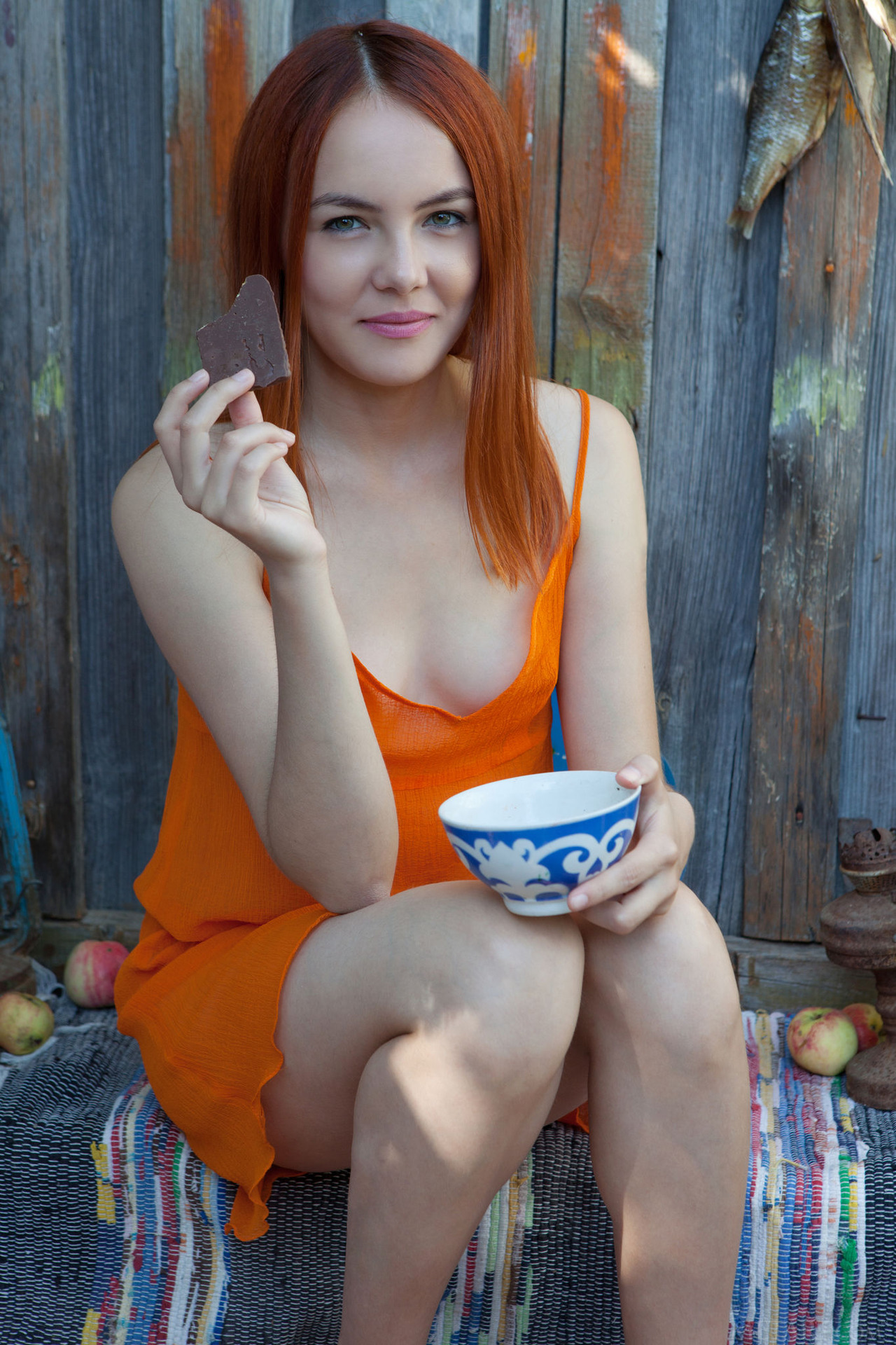Sexy redhead Shaya lets her bright orange dress slip down to bare her gorgeous breasts 02